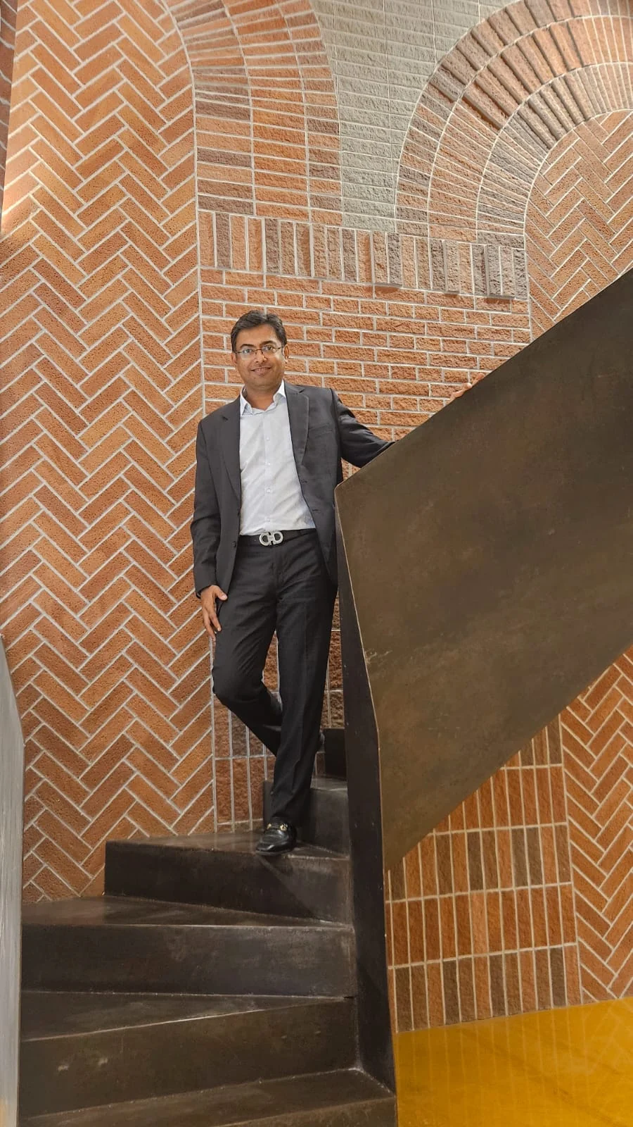 Rohit Sarda in a brick-lined architectural space